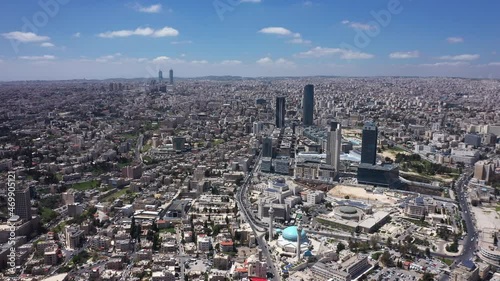 Top view of Amman Jordan city. Aerial Drone fly over futuristic Abdali area district on beautiful day. Residential Modern skyscraper buildings photo