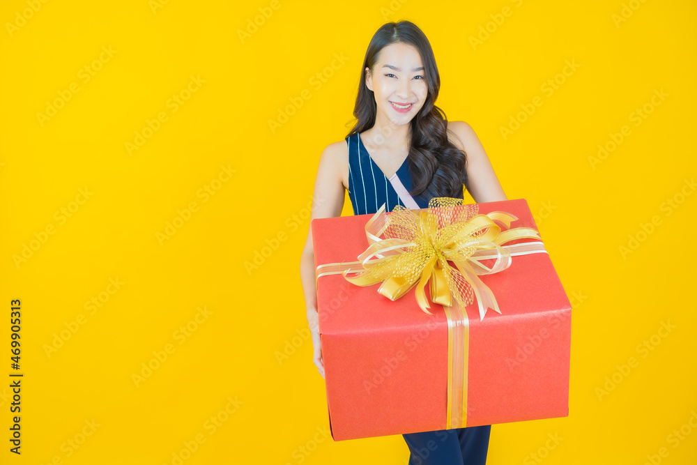 Portrait beautiful young asian woman smile with red gift box Portrait beautiful young asian woman smile with red gift box
