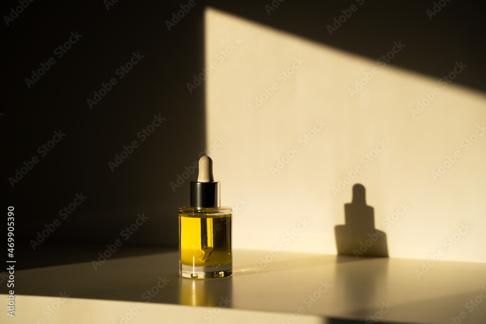 face oil on white background with shadows