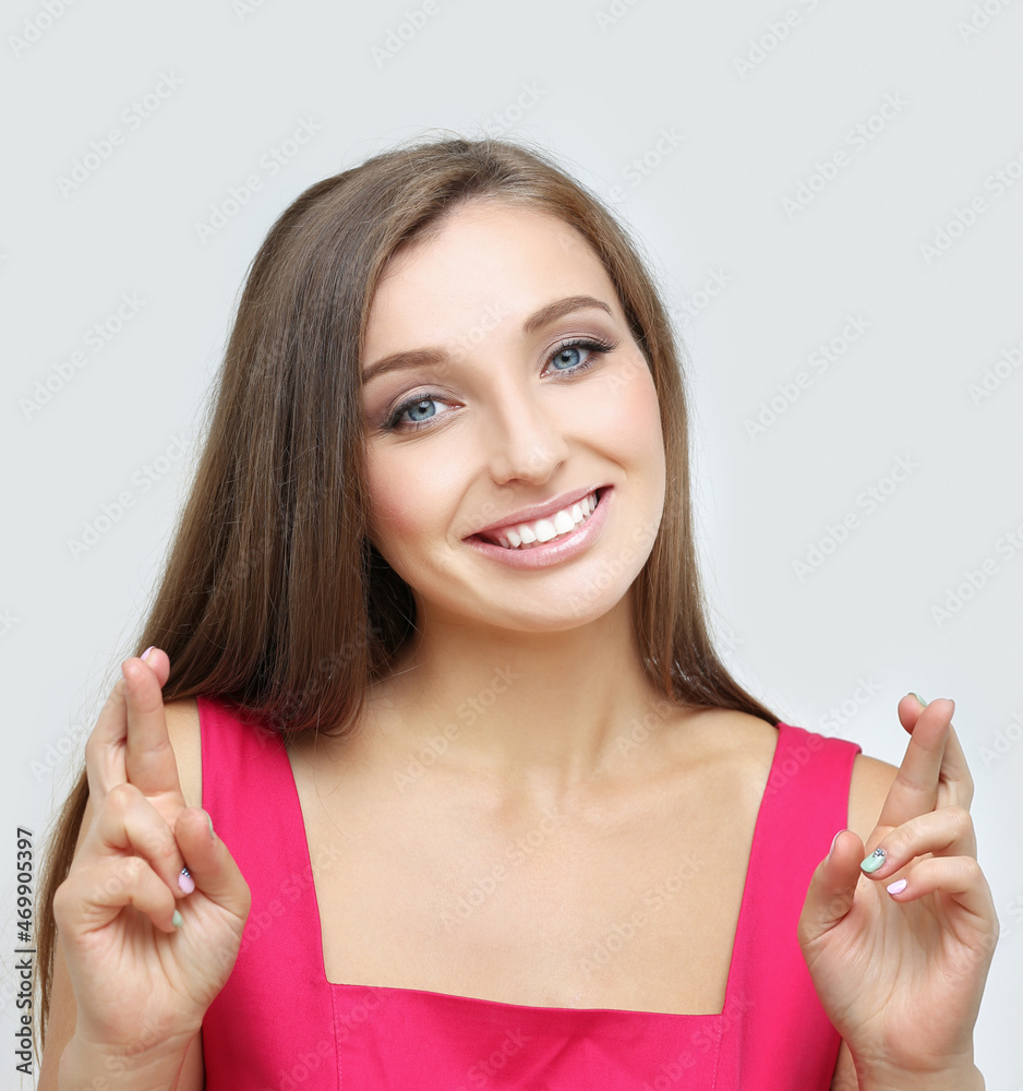 Portrait of smiling girl crossing her fingers. Portrait of smiling girl crossing her fingers.