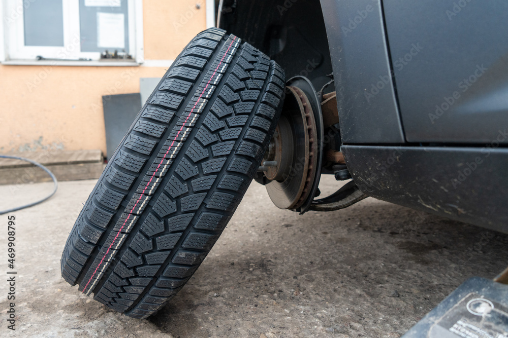 close-up photo of a car wheel taken from a tire fitting car.