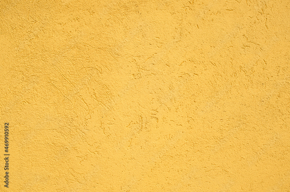 Texture of the yellow stucco wall Texture of the yellow stucco wall