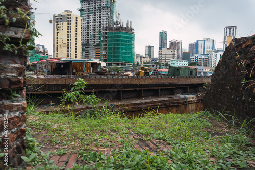 View of the San Nicolas district of Manila from Fort Santiago. In the middle of the Pasig river. Urban photo. landscape cloudy day.
