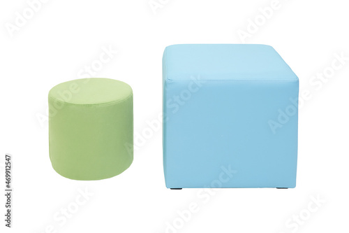 modern green and blue cylindrical and cubic padded stools upholstered with soft fabric in strict style isolated on white background. Creative approach to making furniture in shape of geometric figures