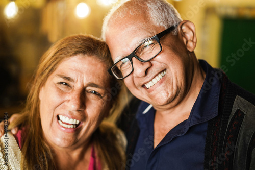 Portrait of senior latin couple having tender moment together - Focus on man face