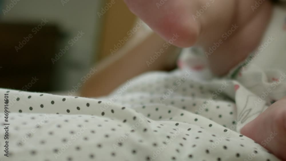 Close up newborn baby girl or boy lying on mother's belly and moving her little cute feet . Mommy and Just borned child on hospital playing with his soft legs . Parent cuddling her child on bed Close up newborn baby girl or boy lying on mother's belly and moving her little cute feet . Mommy and Just borned child on hospital playing with his soft legs . Parent cuddling her child on bed
