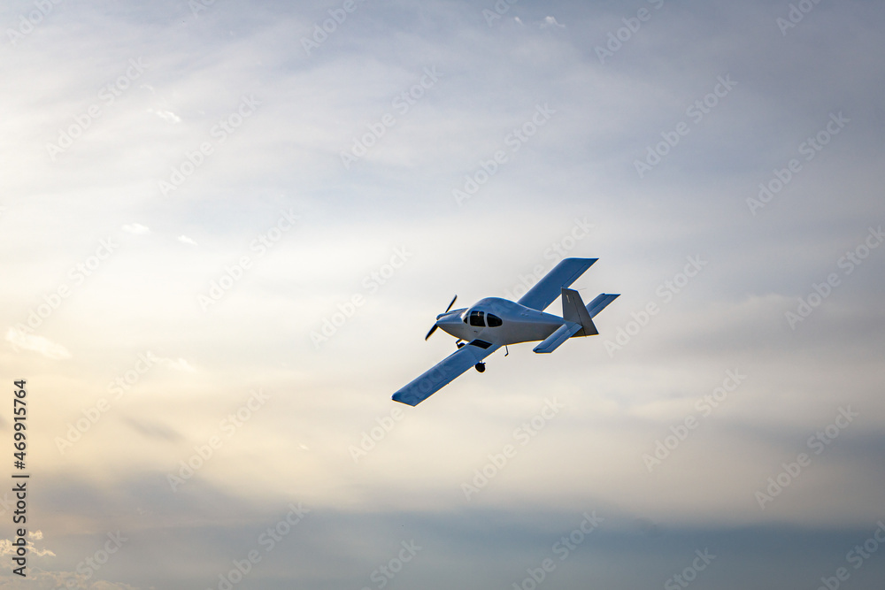 Fototapeta premium Small modern private jet in the sky.