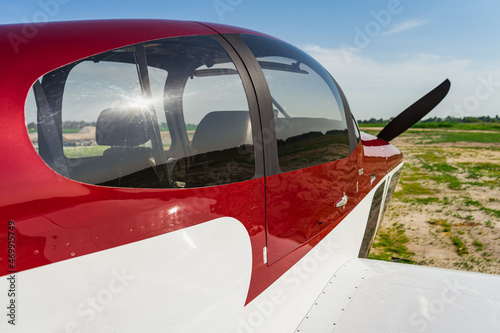 Small private white plane before the flight. Front view. Close-up.
