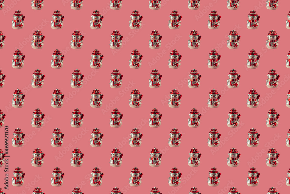 Christmas seamless pattern with snowmen on a pink surface. Winter pattern on a pastel pink background. Christmas ball snowman. Template for wallpaper, holiday packaging