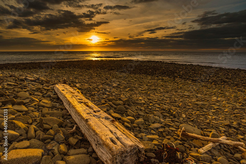 Sunset at low tide on rocky shore of bay of fundy photo