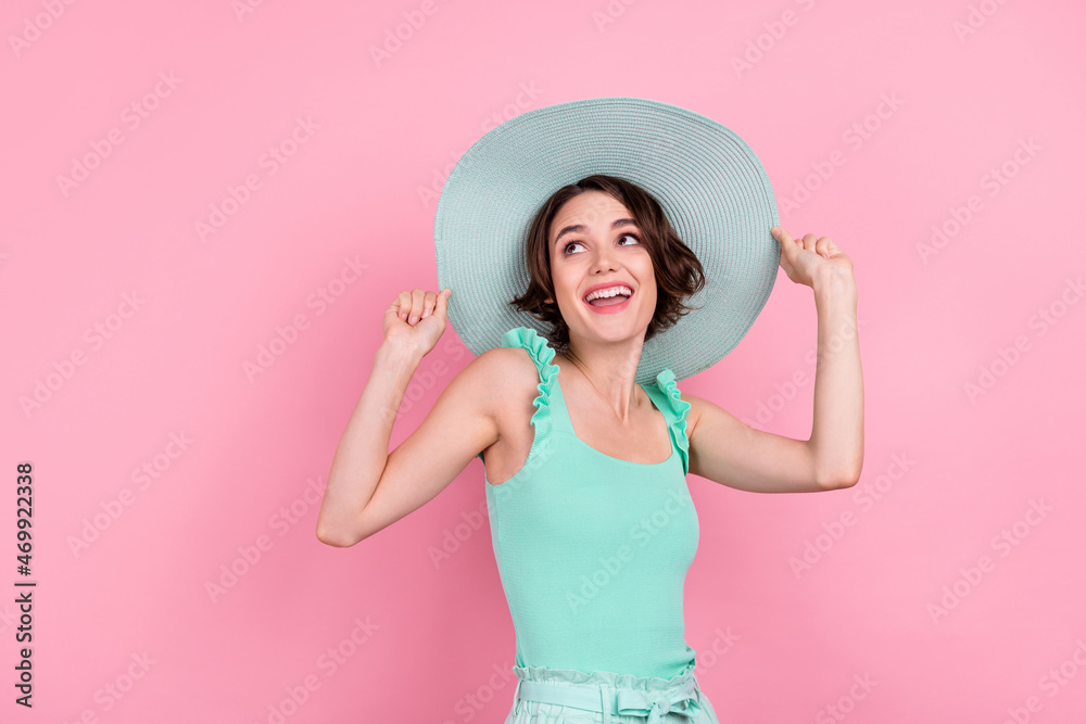 Portrait of attractive cheerful girl wearing sunhat dancing having fun isolated over pink pastel color background Portrait of attractive cheerful girl wearing sunhat dancing having fun isolated over pink pastel color background