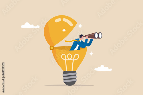 Fototapeta Creativity to help see business opportunity, vision to discover new solution or idea, curiosity, searching for success concept, businessman open lightbulb idea using binoculars to see business vision