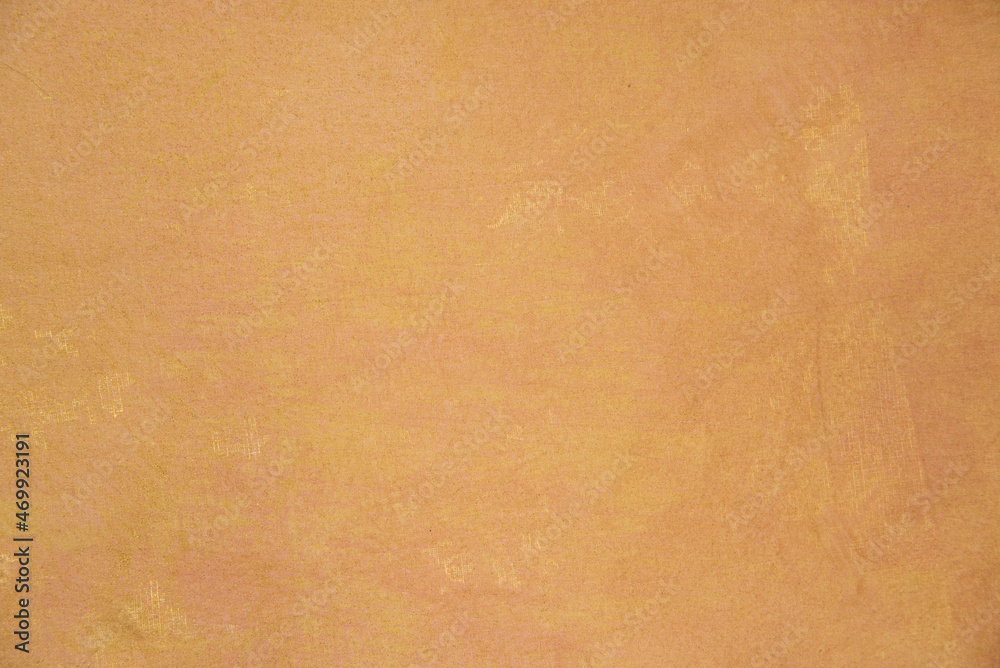 Fototapeta premium Texture de peinture jaune et dorée - peinture sur tissus - création artistique - abstrait