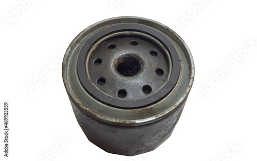 oil filter full flow in black metal housing, screw thread, holes to fill engine oil, ring gasket, disposable, used. isolated on white background