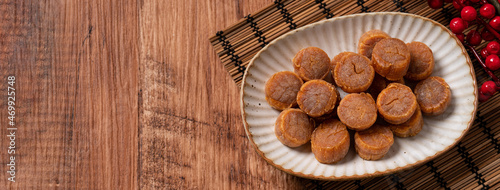 Dried scallop on wooden table.