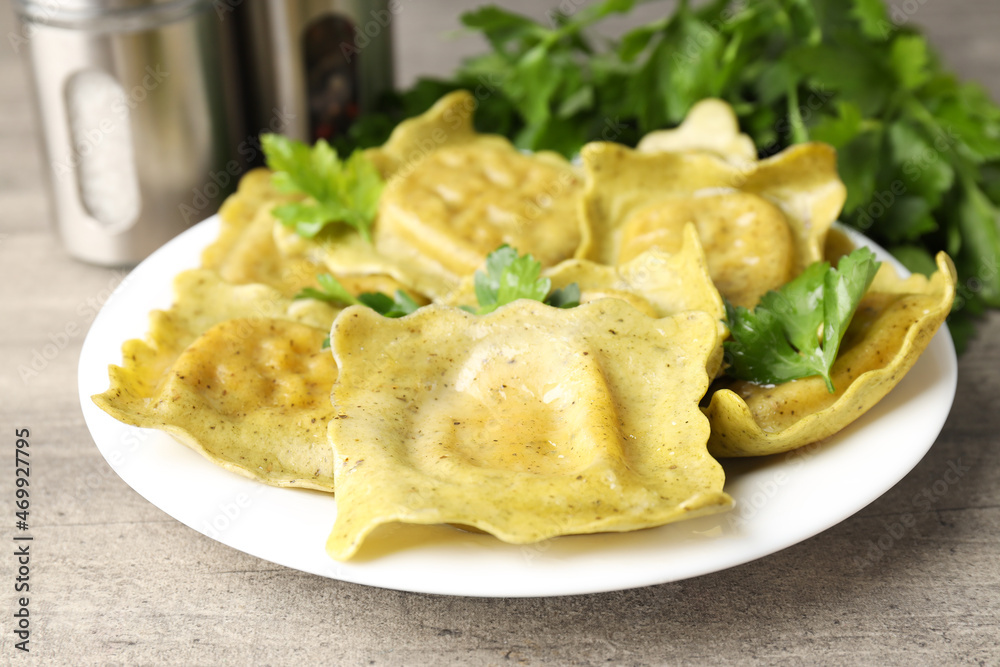 Delicious food concept with ravioli on textured background