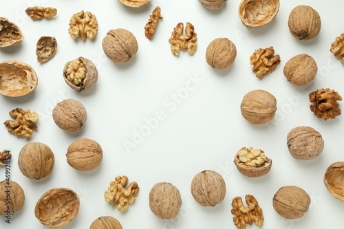 Flat lay composition with walnuts on brown background