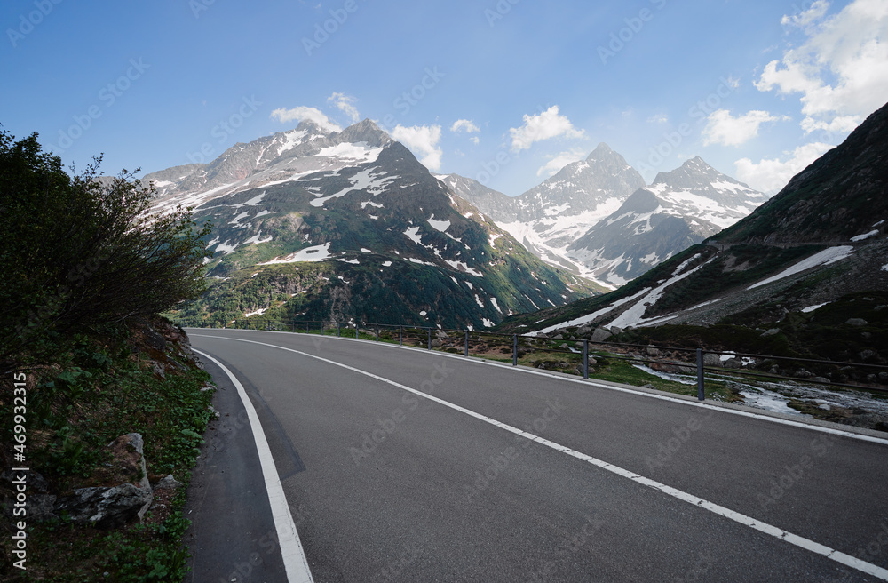 Fototapeta premium Asphalt road in Alp mountains. Road trip concept. Beautiful landscape.