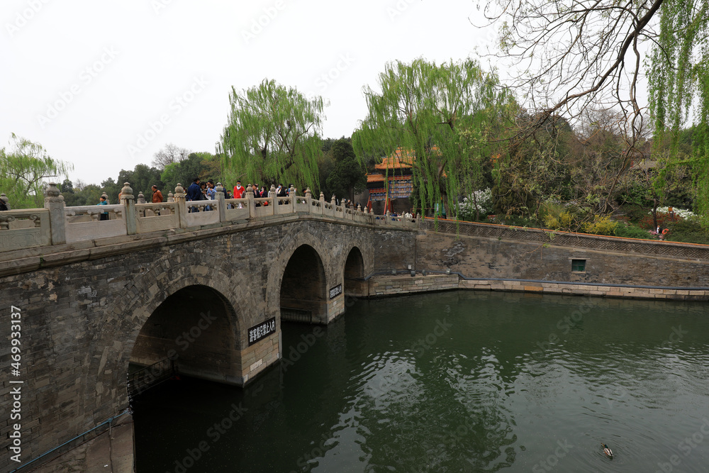 tourists play on the stone bridge, Beihai Park, Beijing tourists play on the stone bridge, Beihai Park, Beijing