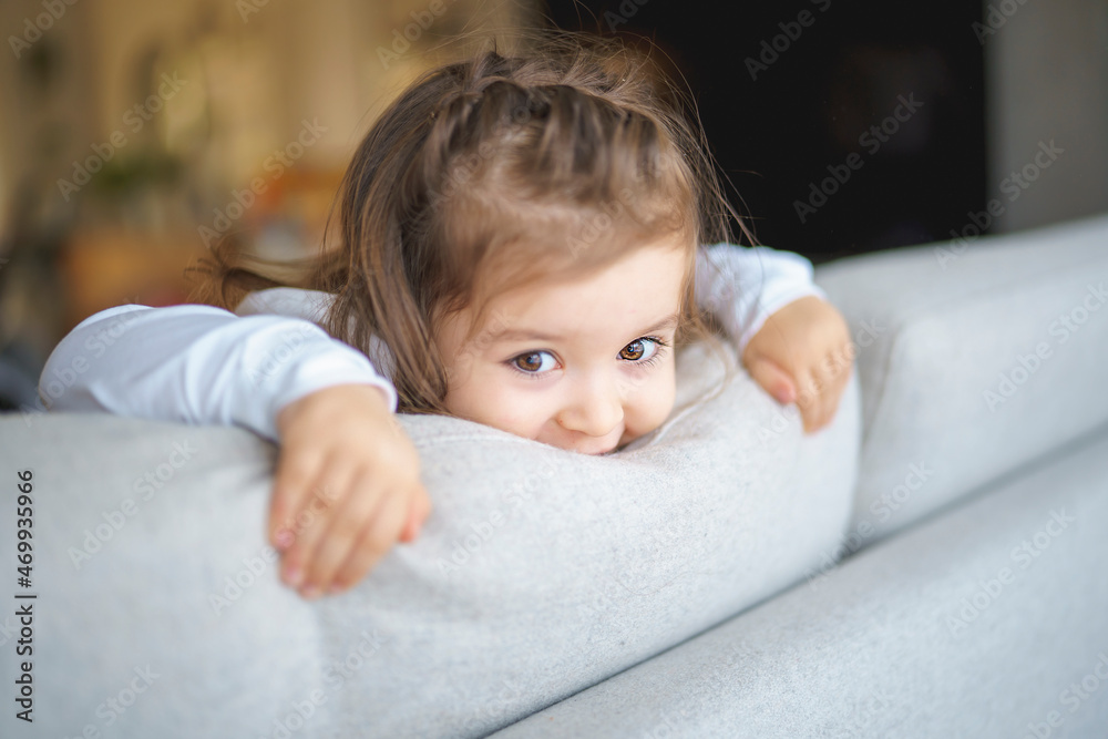 Little crazy girl on living room look like hyperactive Little crazy girl on living room look like hyperactive