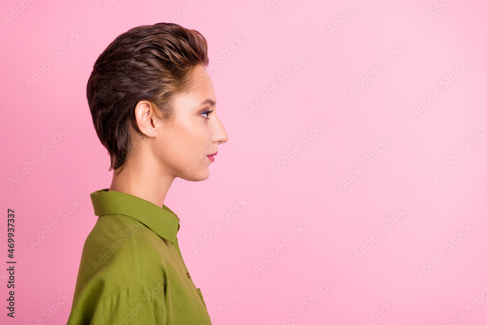Profile photo of calm focused lady serious look empty space wear green shirt isolated pink color background Profile photo of calm focused lady serious look empty space wear green shirt isolated pink color background