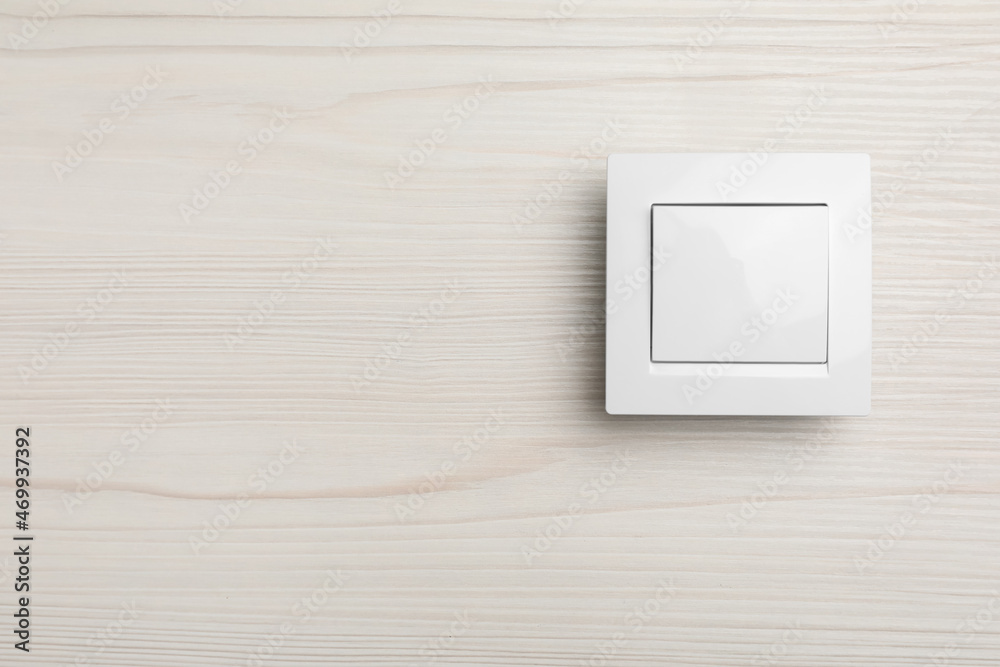 Modern light switch on white background. Space for text Modern light switch on white background. Space for text