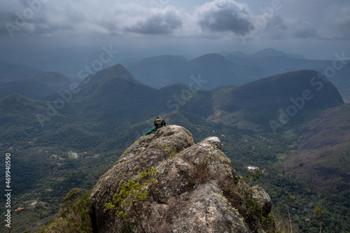 Unidentified hiker on the bare rock of Monte de Milho, Petropolis, Rio de Janeiro, Brazil photo