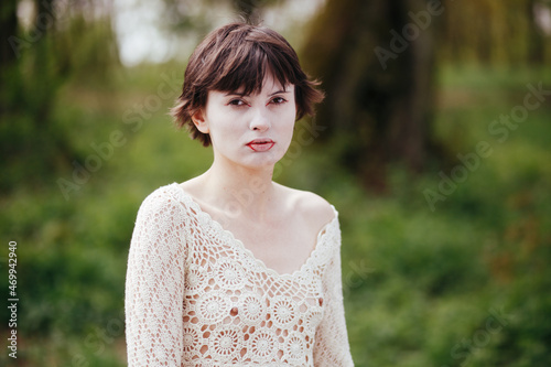 a girl in a hand-made blouse with nipples visible through her clothes