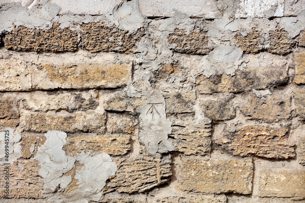 The texture of the old wall, lined with shell stone.