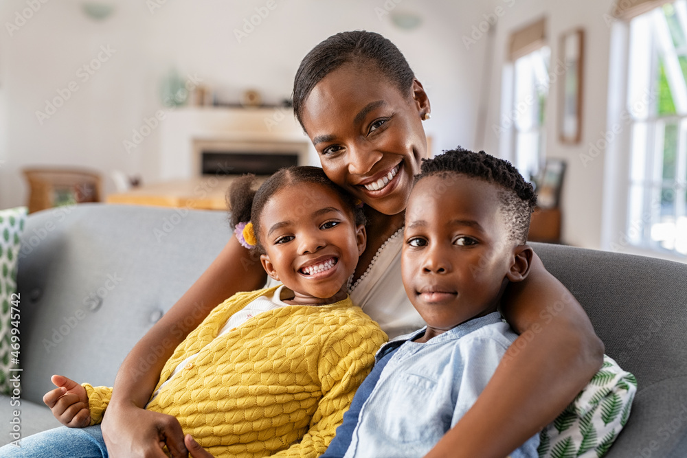 © Rido - Happy african american mother with little son and smiling daughter