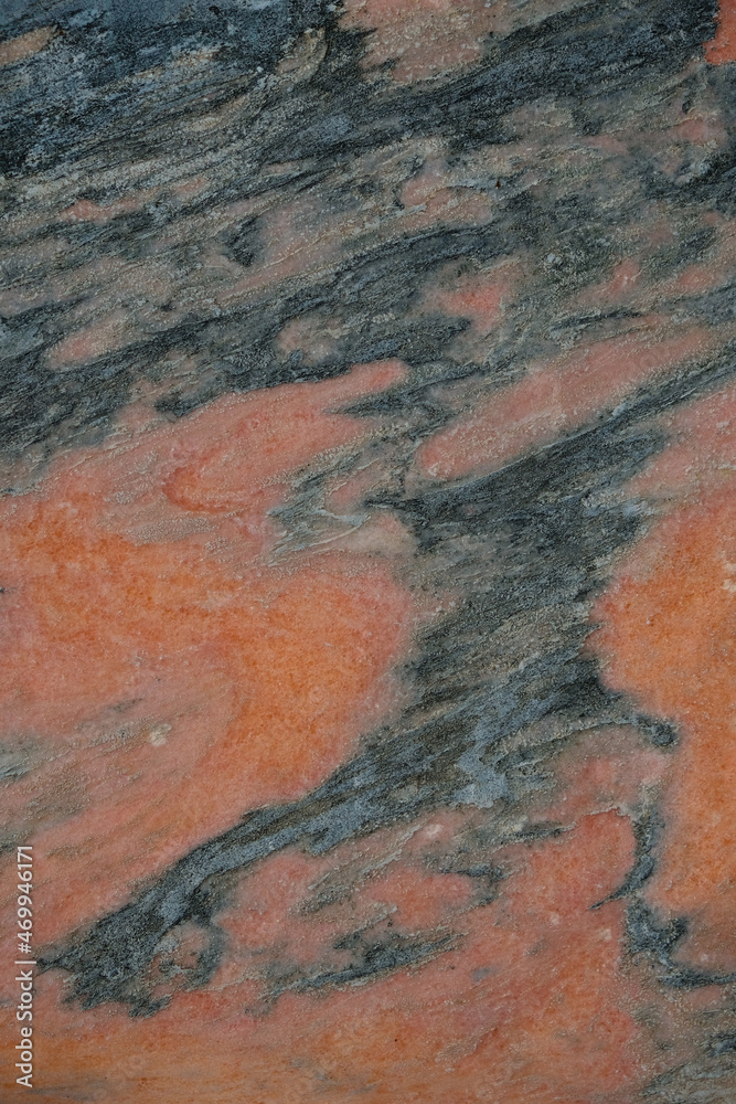 The background of natural stone coral and gray colors. Vertical image. The background of natural stone coral and gray colors. Vertical image.