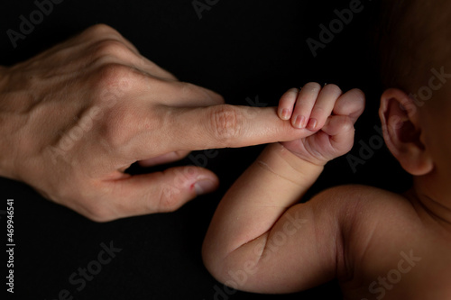 newborn baby holds mom's finger. hand of a newborn baby © Svetlana