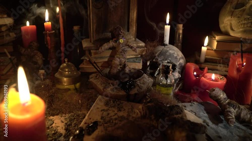 Voodoo ritual table. The general appearance of the ritual scene, prepared in a magical, impressive, dark and frightening atmosphere.