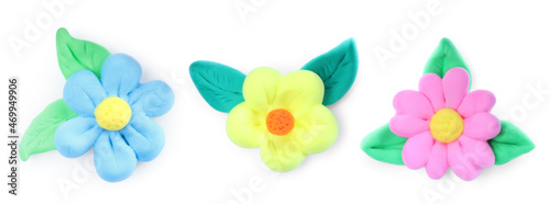 Different flowers with leaves made from playdough on white background, collage. Banner design photo