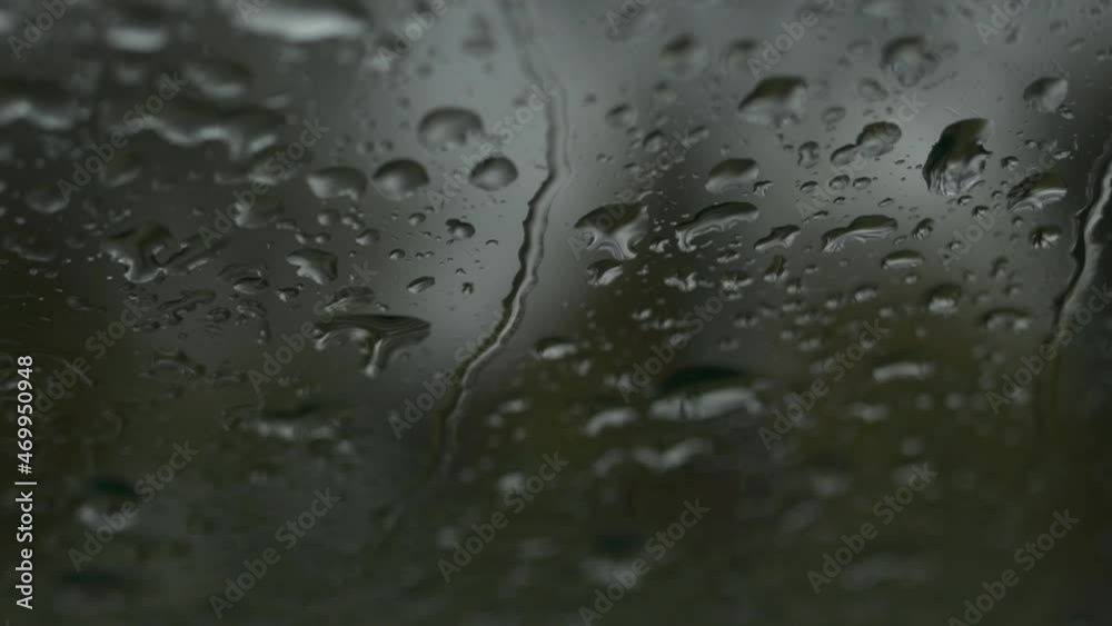 Raindrops on car windshield on rainy autumn day Raindrops on car windshield on rainy autumn day