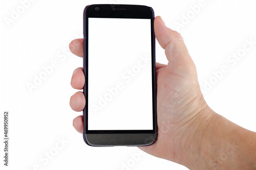 the hand holds a smartphone with a white screen for text.mockup copy space