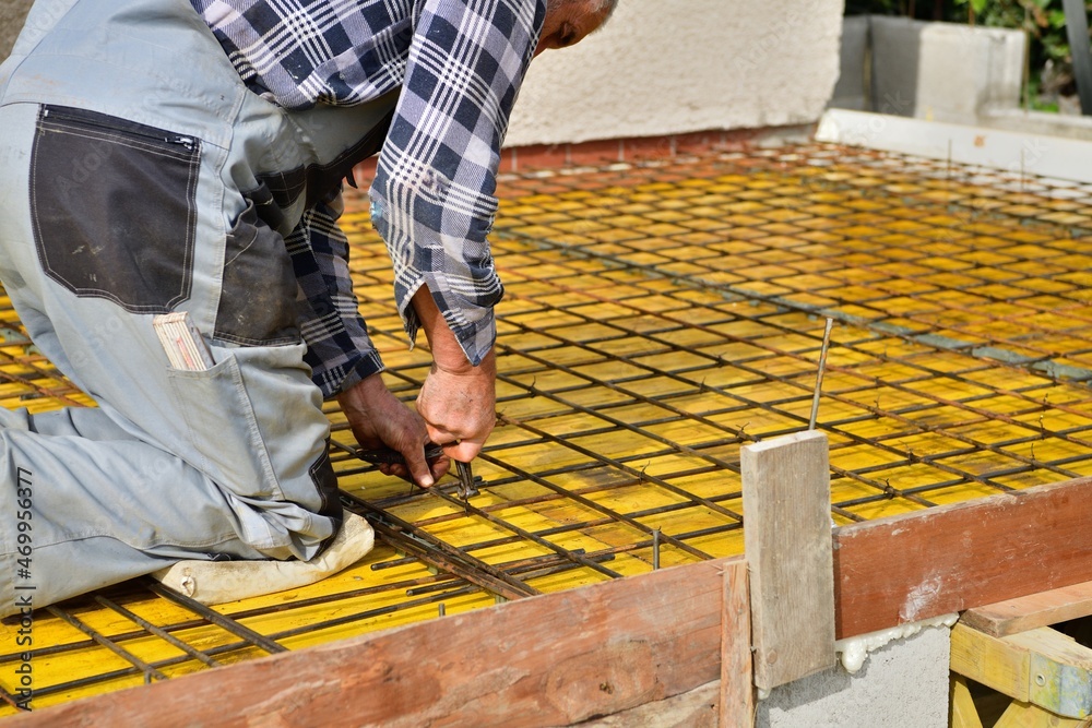 Handmade sheeting with iron pipe at construction site for concreting