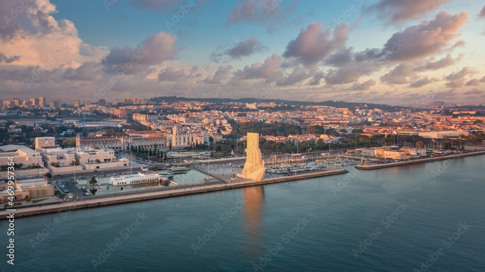 Fototapeta premium Wonderful sunset landscape overlooking the Portuguese Monument to Discoveries, Padrao dos Descobrimentos. Belem. Jeronimos Castle in background.