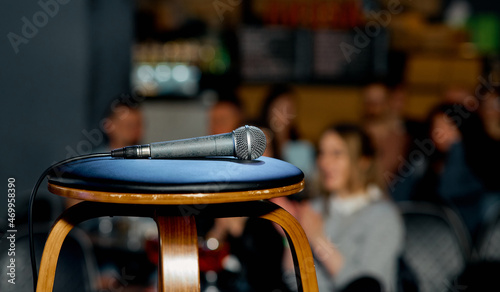 Photos microphone lies on a chair on the stage before the performance
