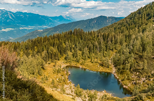 Beautiful alpine summer view with reflections and the famous Dachstein mountains in the background at the Reiteralm, Pichl, Schladming, Steiermark, Austria