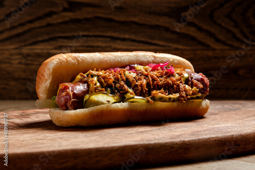 fast food hot dog with homemade sausage, deep-fried onions and pickled cucumbers