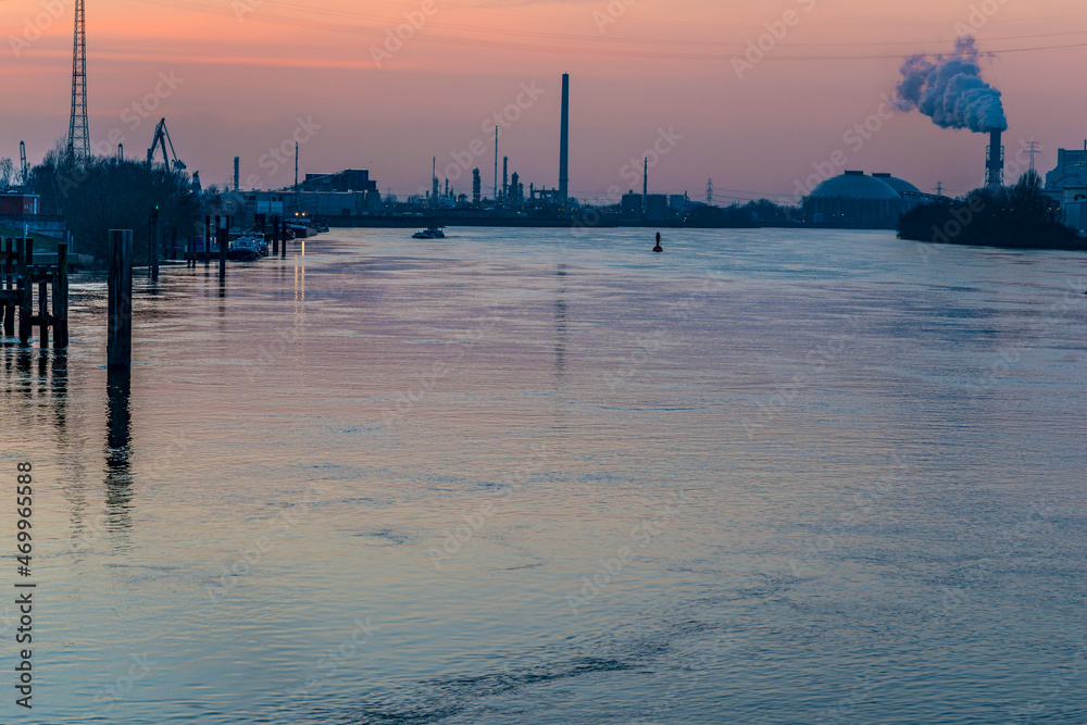 Industrial landscape - a view from the old Süderelbbrücke in Hamburg Harburg after sunset with afterglow