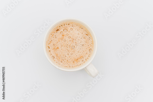 delicious hot vegan Cappuccino with foam in a white stoneware cup on a white background