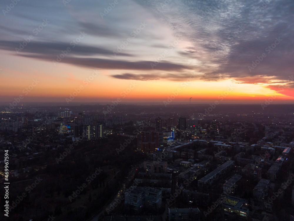 Aerial scenic vivid colorful sunset view with epic skyscape. Kharkiv city center, recreation park Sarzhyn Yar, Pavlove pole residential district streets in evening light