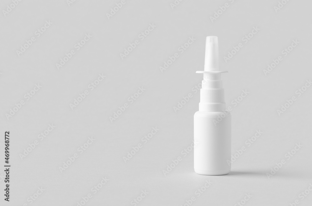 Nasal spray mockup. White plastic bottle with blank label. Nasal spray mockup. White plastic bottle with blank label.