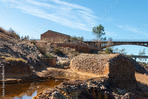 Vestiges of an old water mill on the waters of the Rio Tinto, a Spanish river that runs through the province of Huelva