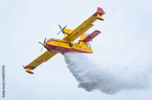 Firefighting seaplane collecting water in the sea.