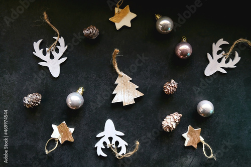 Various Christmas ornaments on dark background. Flat lay.
