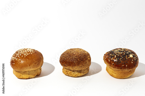 Assortment of small round brioche buns with homemade seeds