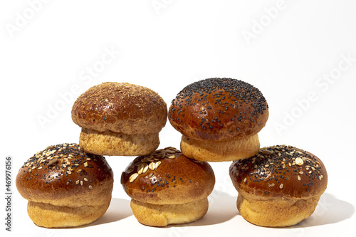 Assortment of small round brioche buns with homemade seeds